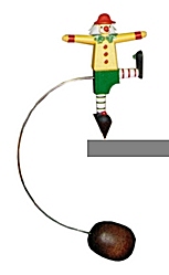 Wolfgang Werner Clown grün/ gelb (Wolfgang Werner 363) Erzgebirgische Volkskunst: Diese Schaukelfiguren werden auf eine Tisch- oder Regalkante gesetzt und schaukeln dann hin und her.